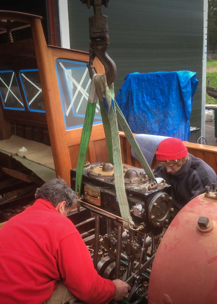 Adrian Stone and Matt Foot fitting the engine into position