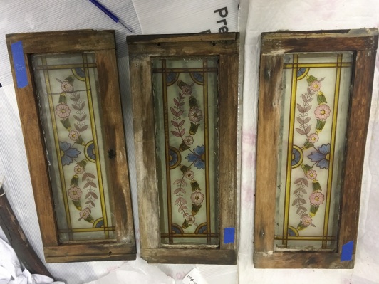 Some of the painted glass panes being prepared for conservation